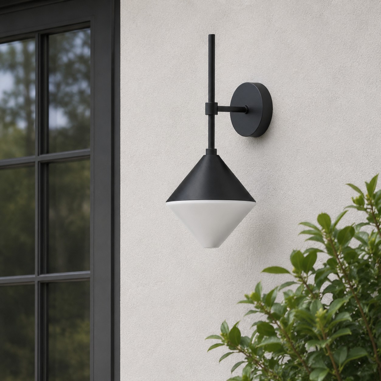 black and white waterproof wall sconce on an exterior wall beside a window
