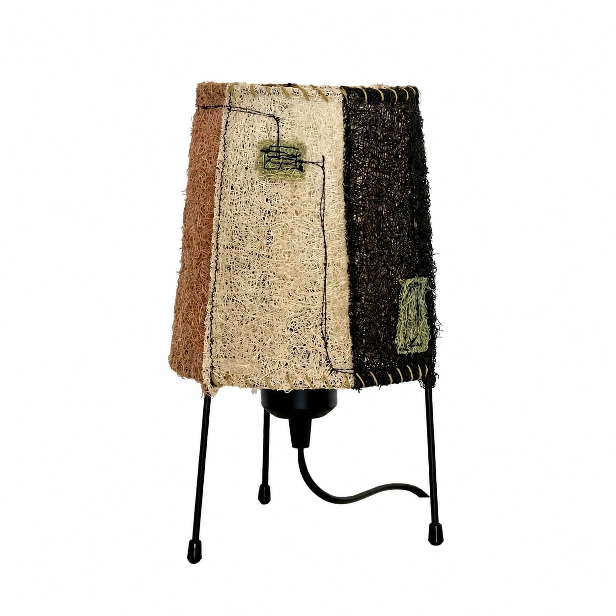 Patchwork plant fiber table lamp on white background