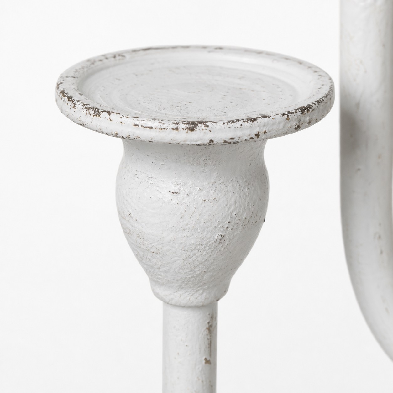 Close view of ivory branch candle cup and distressed finish