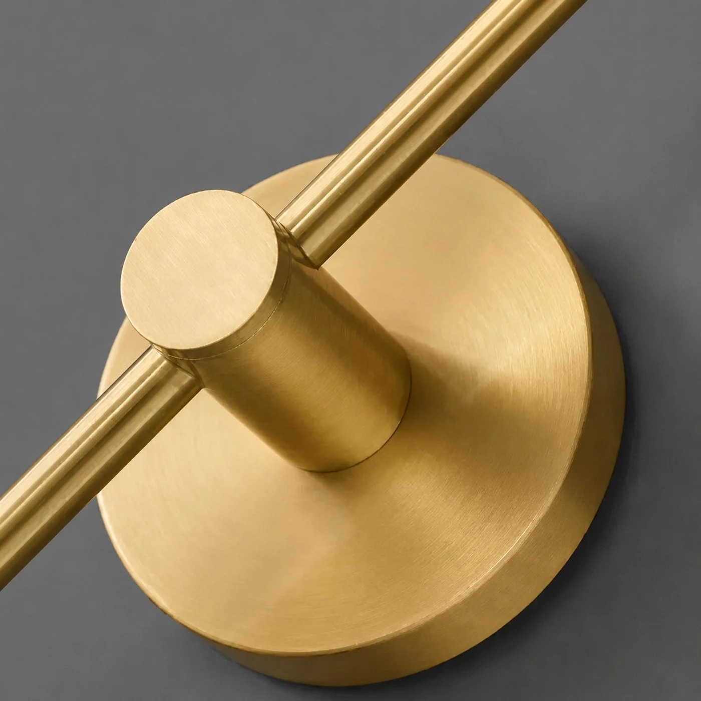 Brushed copper round wall plate and arm detail