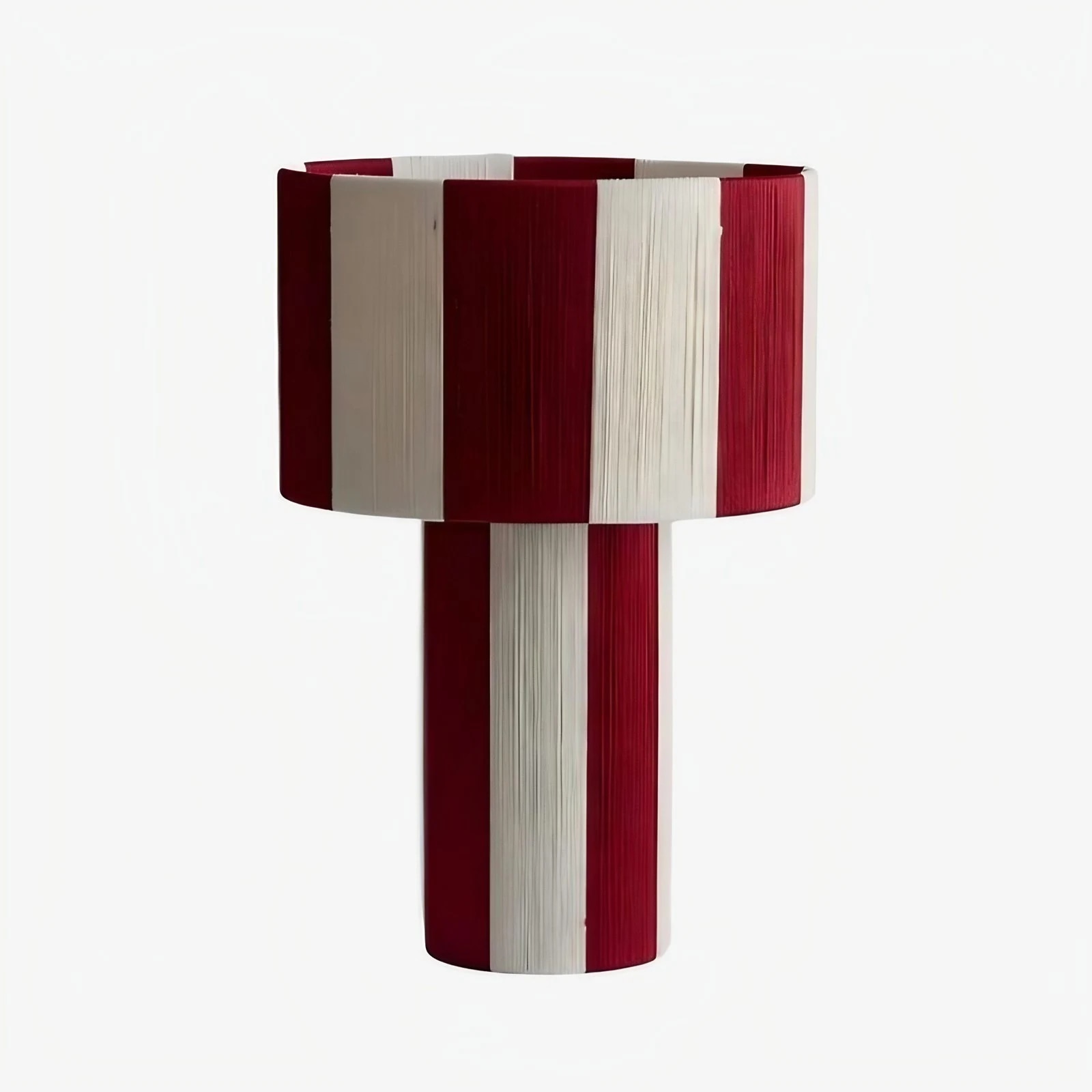 Burgundy purple and white striped woven shade table lamp on a white background