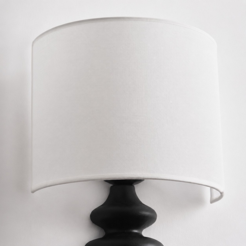 Ebony wall lamp shade and curved arm detail