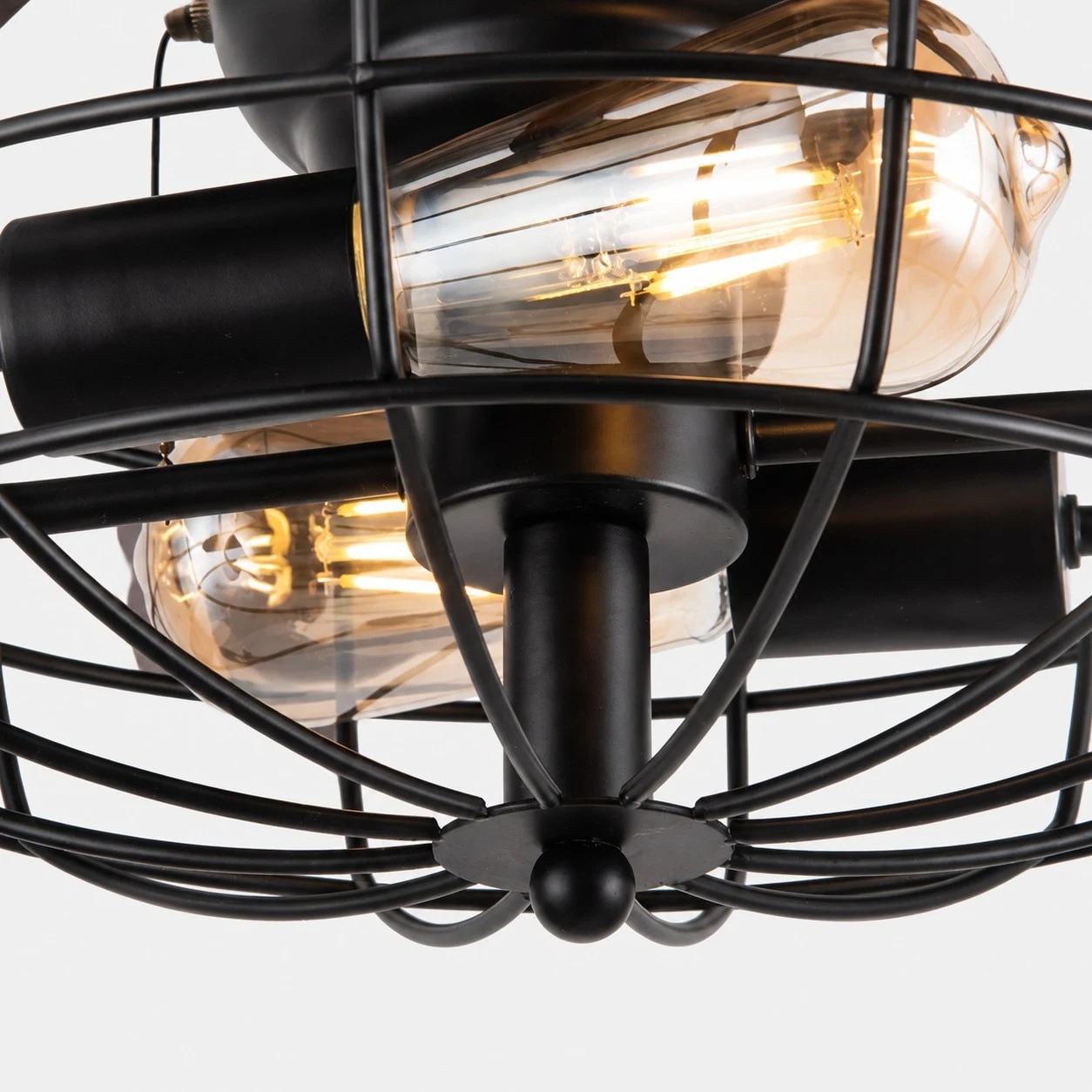 Close view of caged bulb frame and warm light