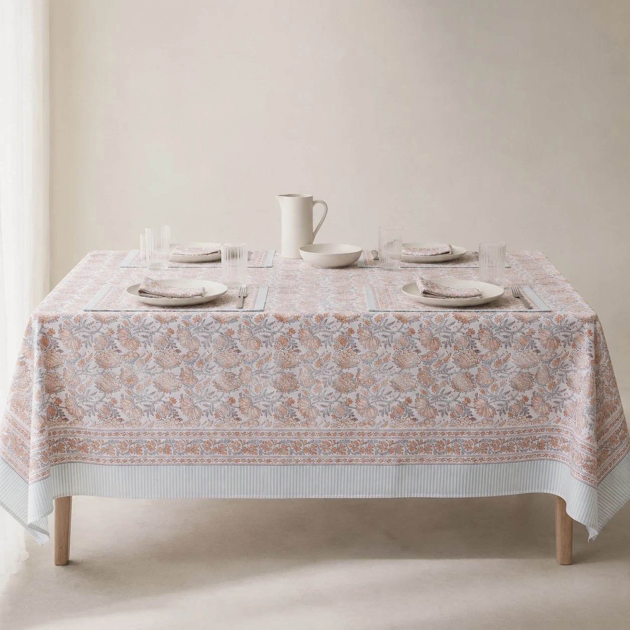 Mist blue floral tablecloth on a dining table