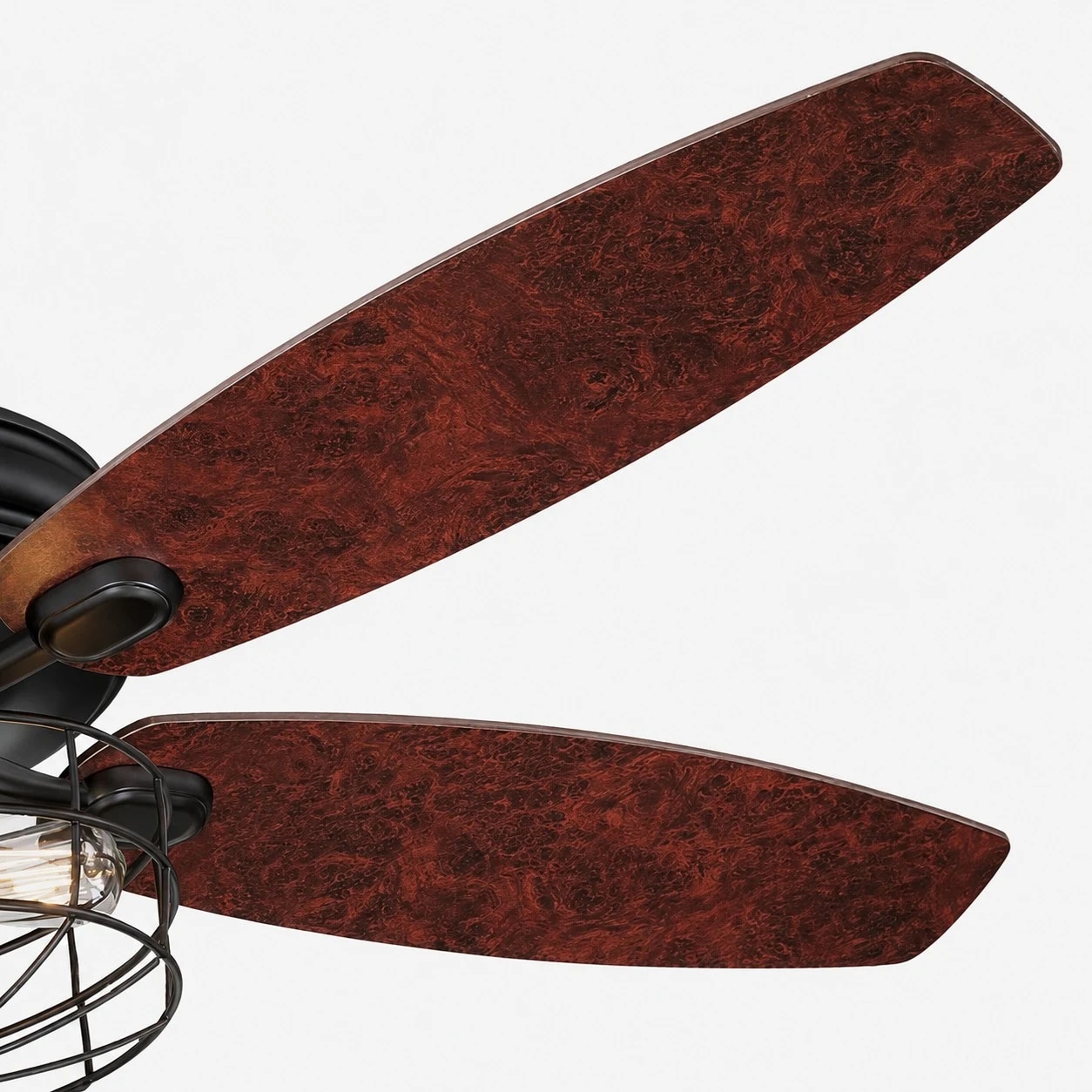Close view of wood tone fan blades and cage light