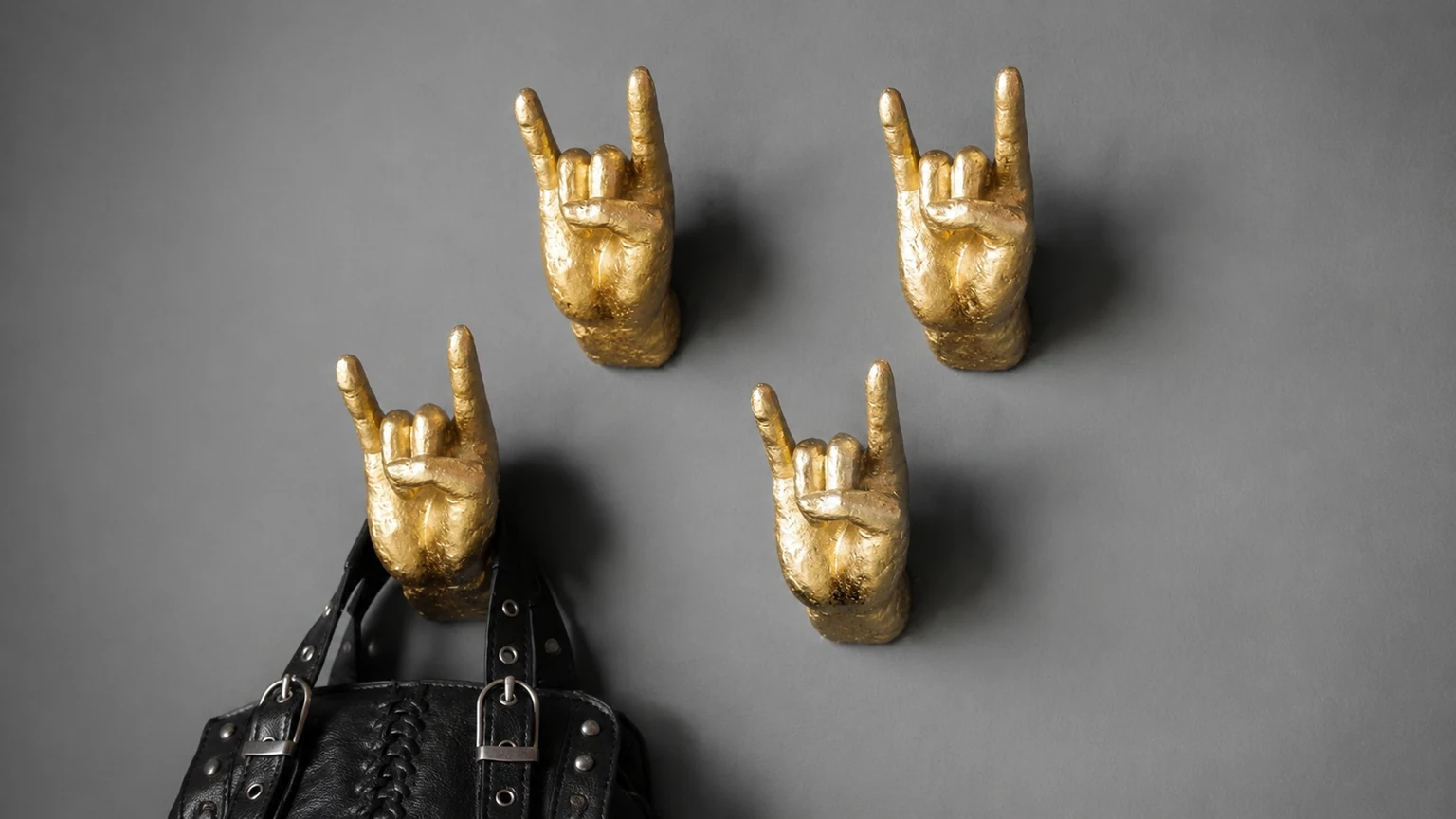Gold Set of 4 Rock On Wall Hands styled on a wall