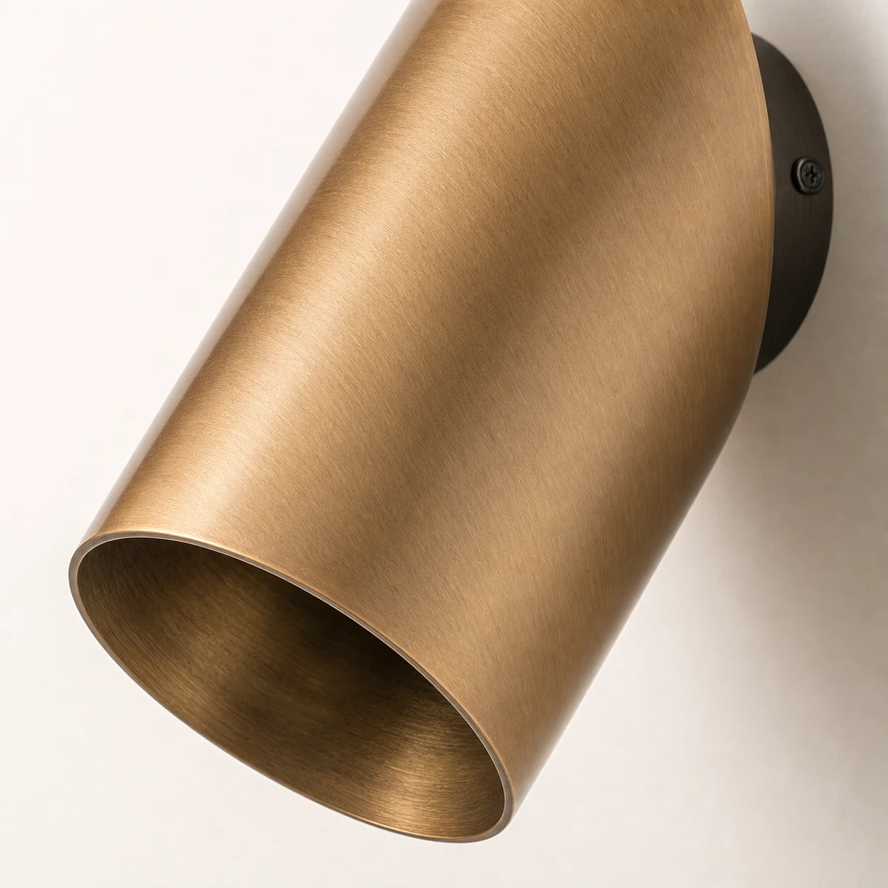 Close-up detail of the Guilla brass angled cylinder spotlight finish
