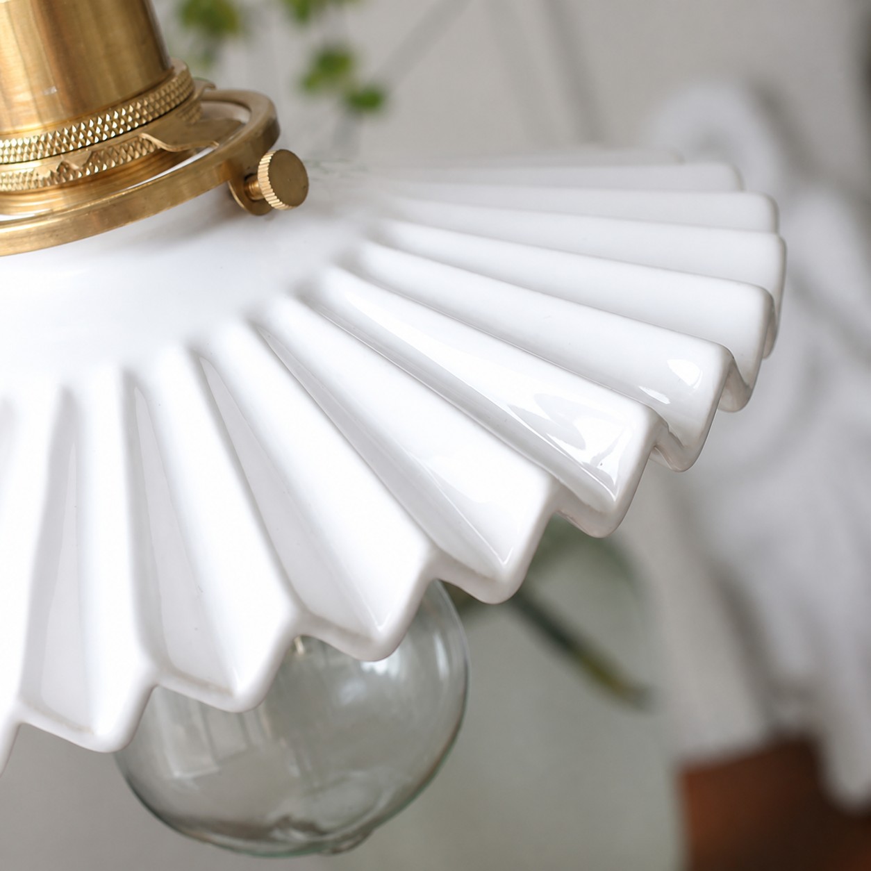 Close-up of glossy pleated ceramic shade